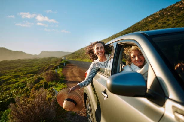 A car on an open road for the 'road trip' use case.